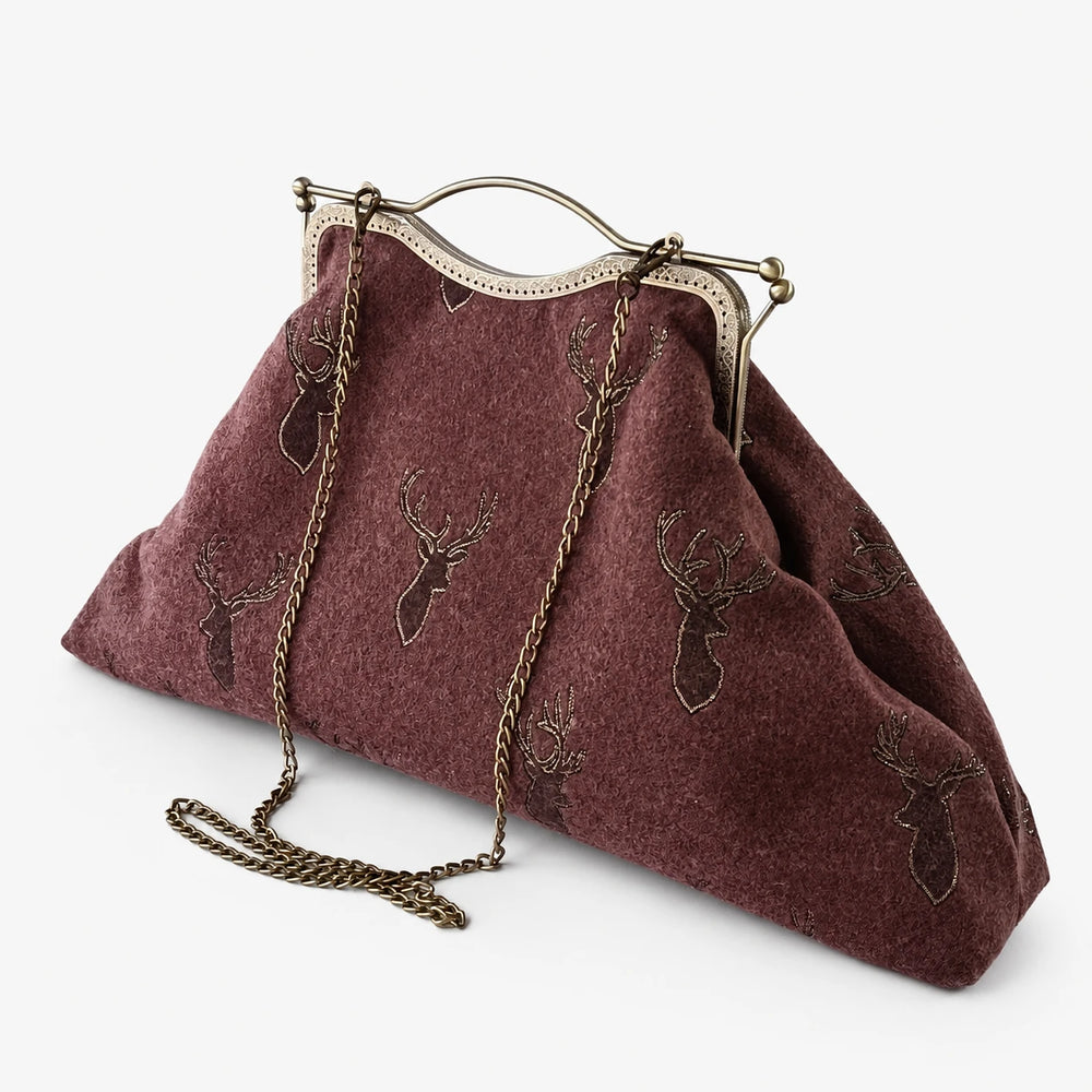 Brown handbag with deer embroidery on a white background