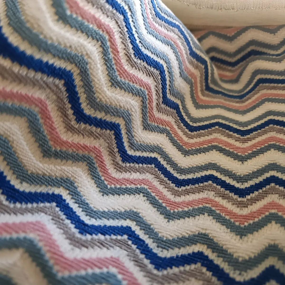 Close-up of a fabric with wavy, multicolored pattern