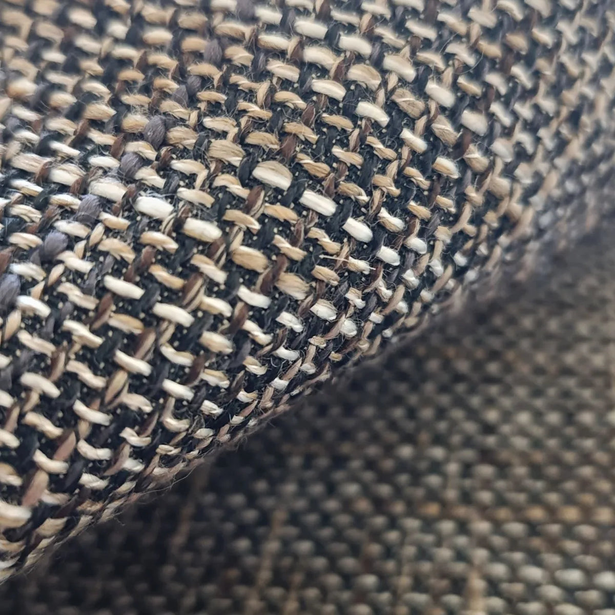 Close-up of a textured fabric with a woven pattern